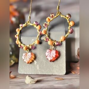Gold plated wire hoop earrings with orange copper color and copper color beads